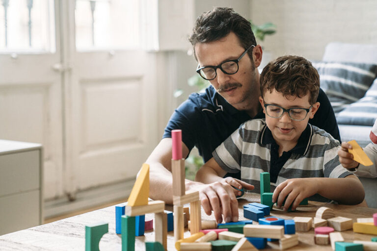 Family playing with building blocks