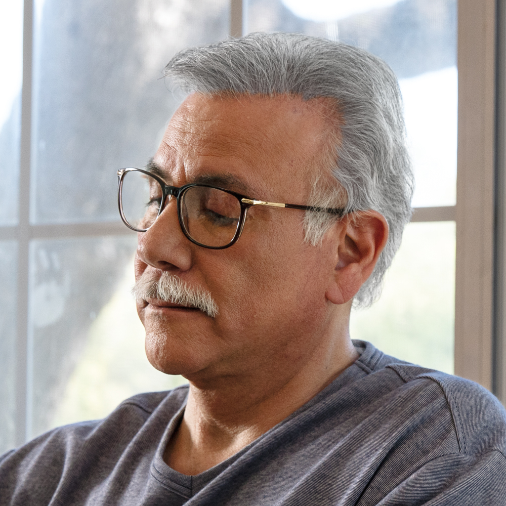 Older man wearing glasses