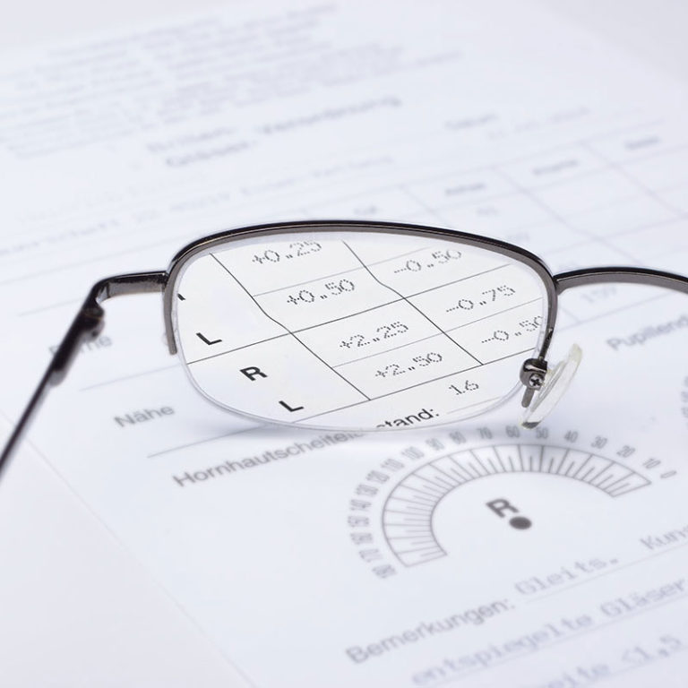 Close up of glasses focusing on vision prescription