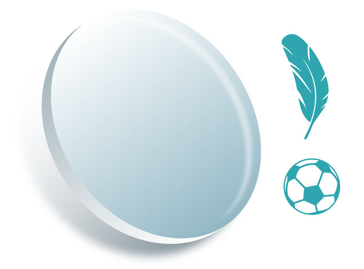 Eyeglass lens with feather and soccer ball next to it