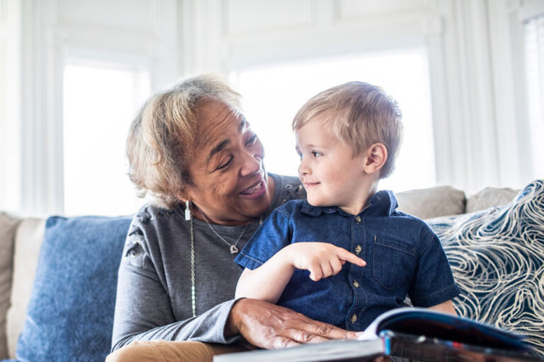 Older woman and child reading a book