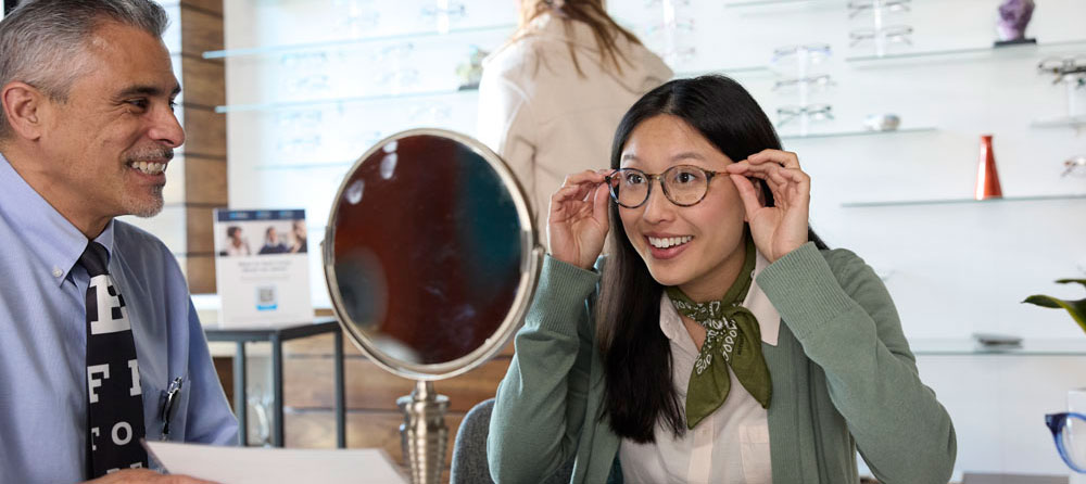 Woman trying on eyeglasses