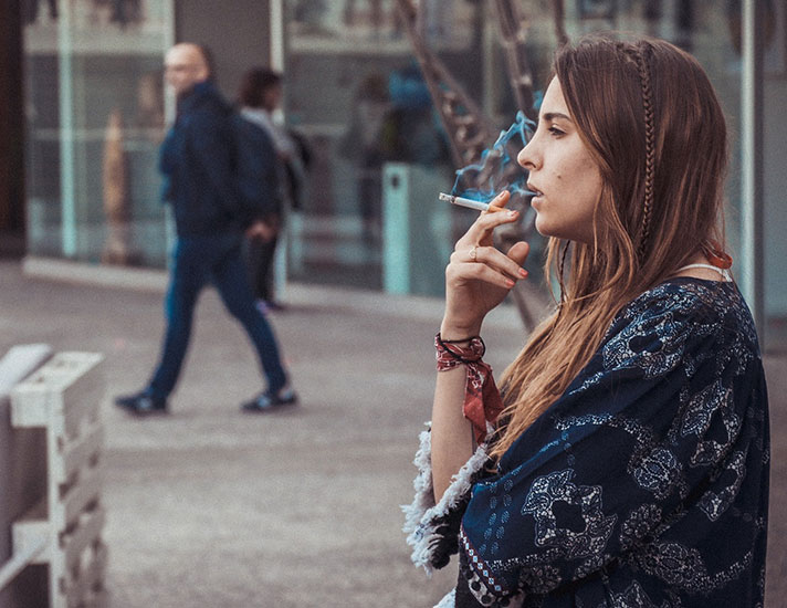 Woman smoking in public